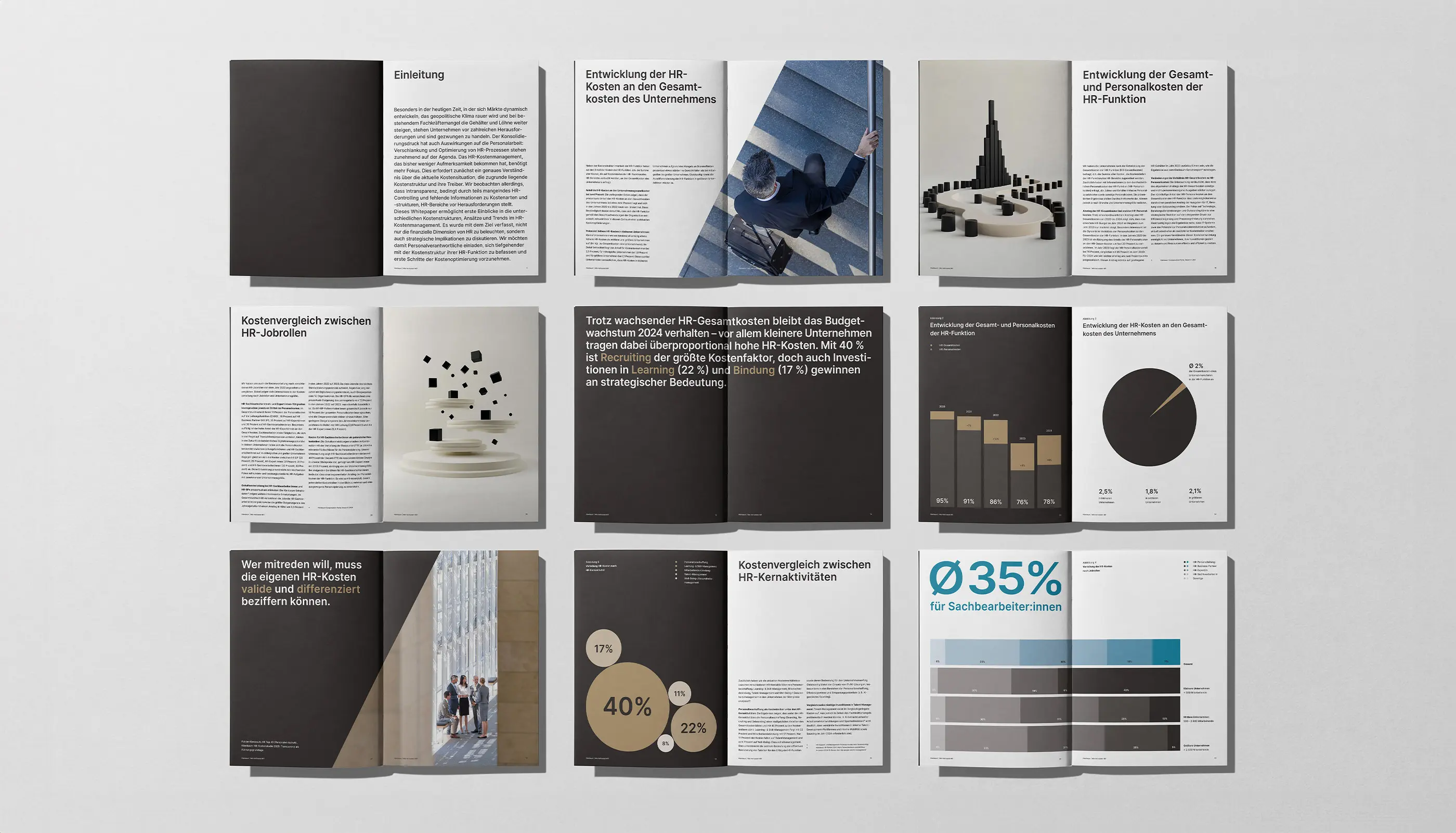 Open brochures featuring business content with charts, graphs, text, and photos of professionals and abstract shapes on a white surface.